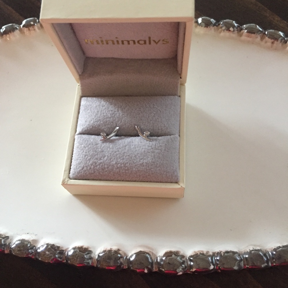 14 k White gold diamond earrings.